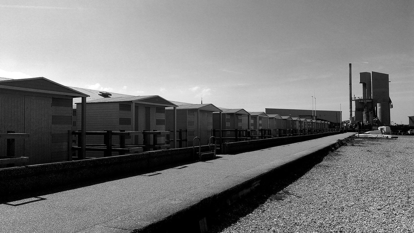 ICMSTUDIOS - A row of beach huts in Whitstable - near an aggregate plant!